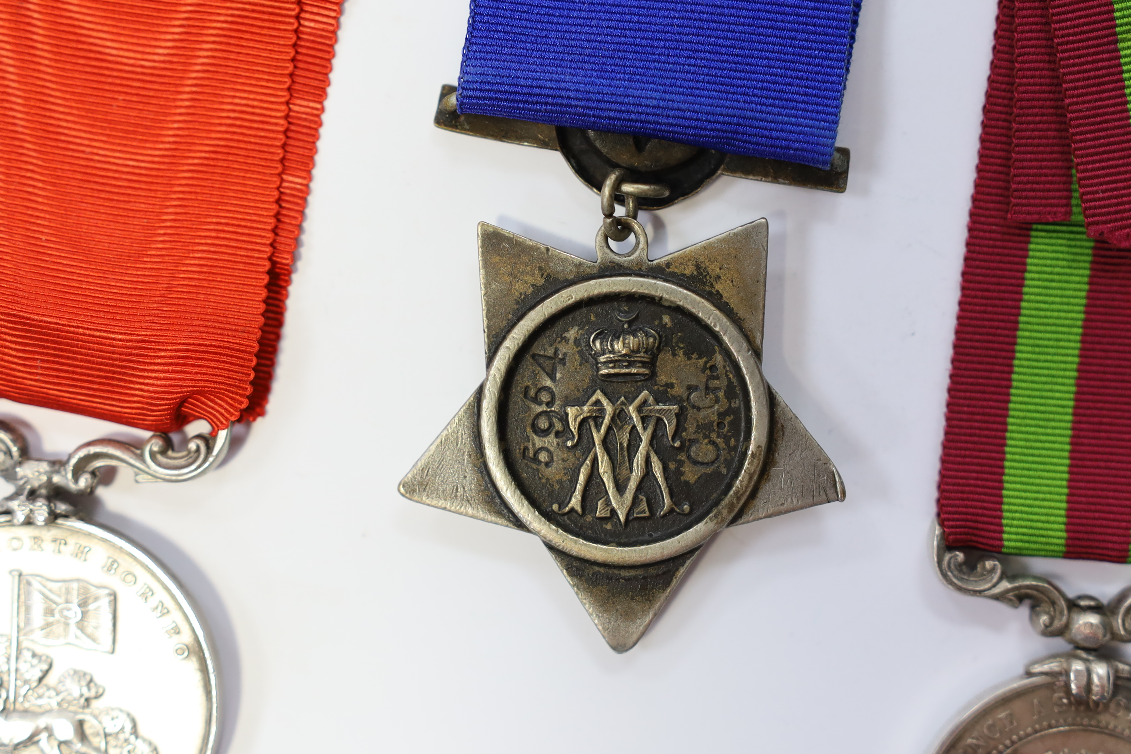 Replica medals; Khedive's Star 1884-6 and another undated; Ashanti star; Spink British North Borneo medal, a loose North West Frontier 1930-31 clasp and a Total Abstinence India medal 50-80